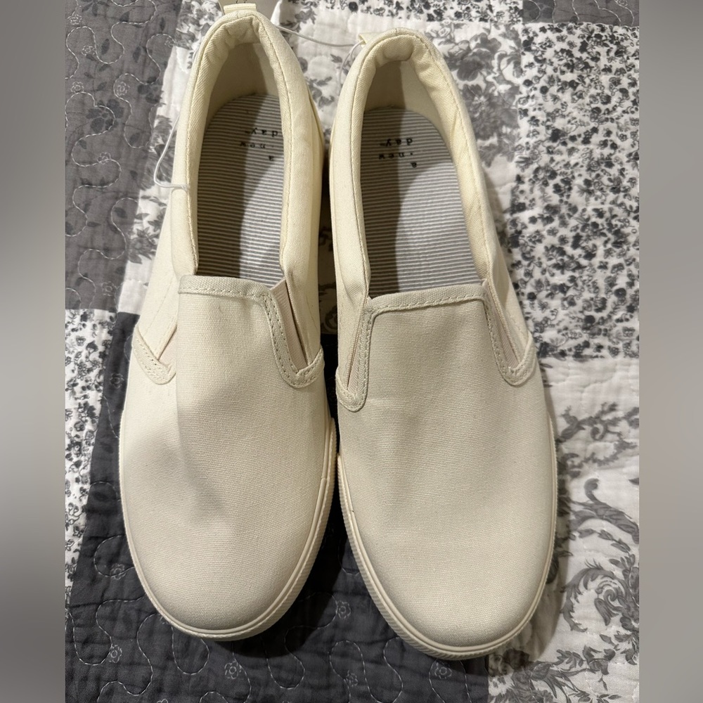Cream slip ons